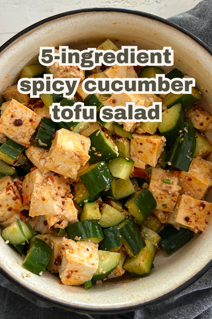 An easy spicy, Asian-style cucumber salad recipe with soft tofu, cucumbers, chili crisp/chili crunch, sesame seeds